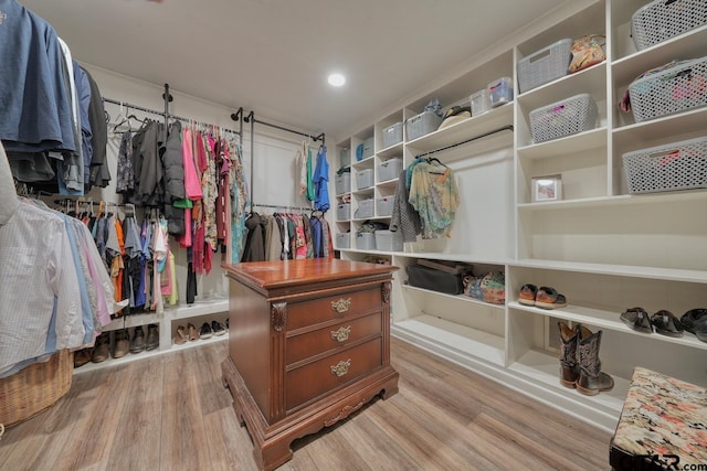 walk in closet featuring light wood-style flooring