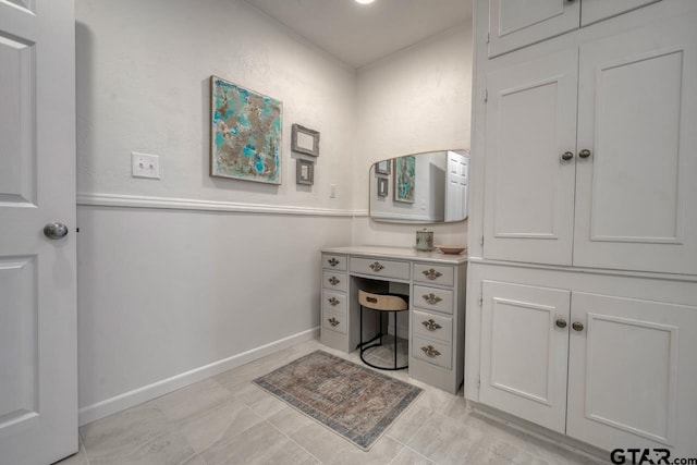 bathroom with vanity and baseboards