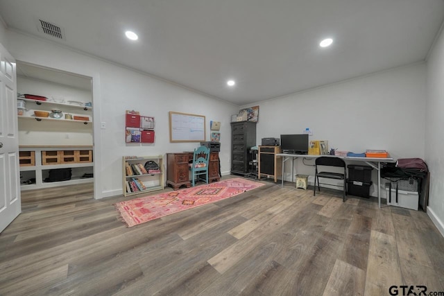 office area with recessed lighting, visible vents, wood finished floors, and crown molding