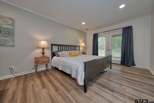 bedroom with access to exterior, baseboards, recessed lighting, french doors, and wood finished floors