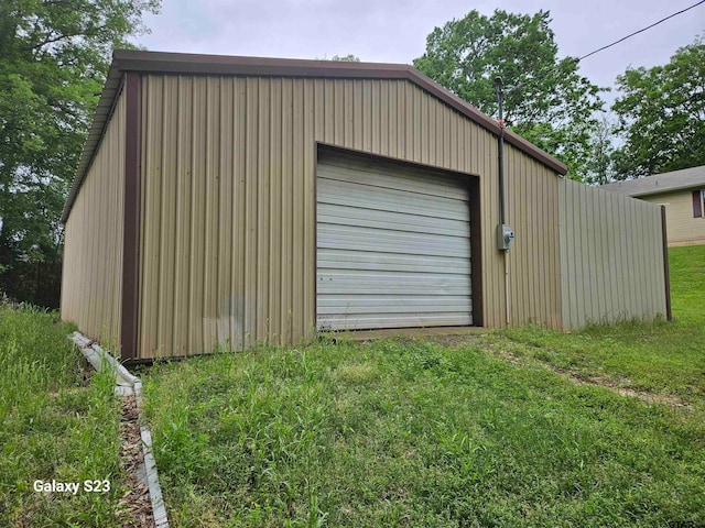 garage featuring a yard