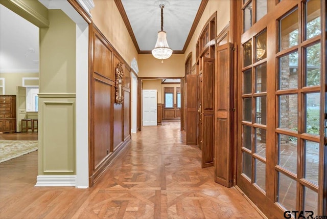 612 Rosemont Pl, Ii Place, Tyler, TX 75701 - hall featuring crown molding, a decorative wall, a chandelier, and a wainscoted wall
