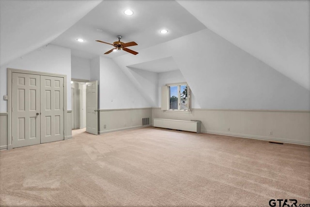 612 Rosemont Pl, Ii Place, Tyler, TX 75701 - additional living space with vaulted ceiling, carpet floors, ceiling fan, recessed lighting, and radiator heating unit