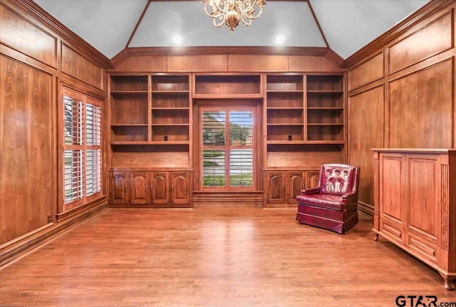 612 Rosemont Pl, Ii Place, Tyler, TX 75701 - unfurnished room featuring lofted ceiling, a chandelier, light wood-type flooring, and wooden walls