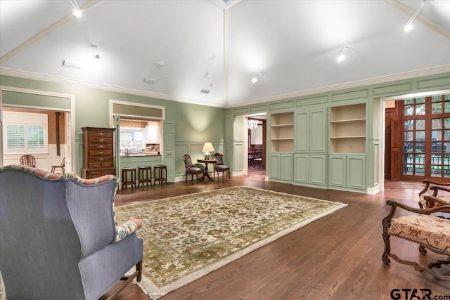 612 Rosemont Pl, Ii Place, Tyler, TX 75701 - living room with a decorative wall, lofted ceiling, dark wood-style flooring, ornamental molding, and built in features
