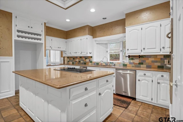 612 Rosemont Pl, Ii Place, Tyler, TX 75701 - kitchen with stainless steel dishwasher, black electric cooktop, white cabinets, a kitchen island, and a wainscoted wall