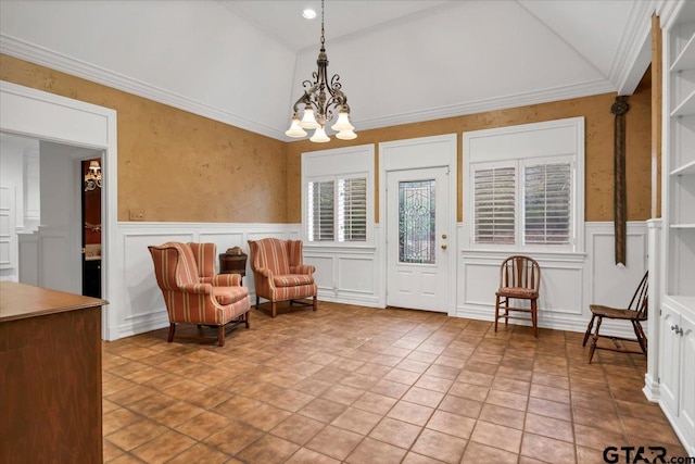 612 Rosemont Pl, Ii Place, Tyler, TX 75701 - living area with a chandelier, a decorative wall, wainscoting, vaulted ceiling, and crown molding