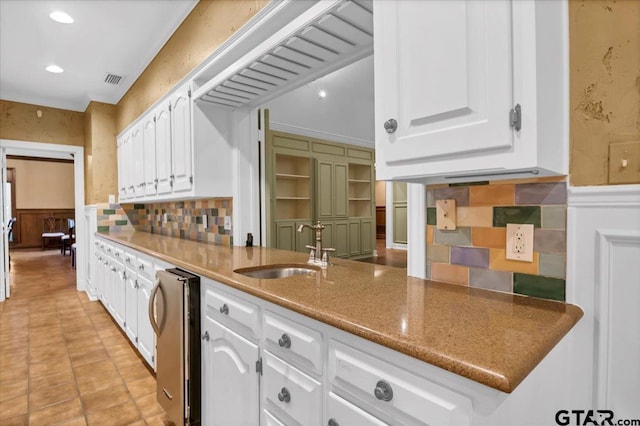 612 Rosemont Pl, Ii Place, Tyler, TX 75701 - kitchen with white cabinetry, a wainscoted wall, and recessed lighting