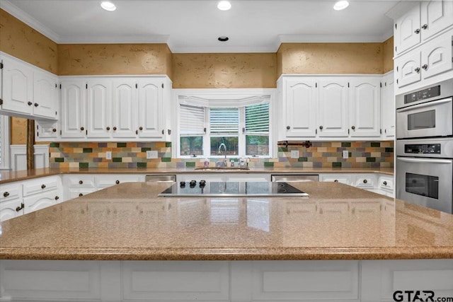 612 Rosemont Pl, Ii Place, Tyler, TX 75701 - kitchen featuring stainless steel appliances, white cabinetry, light stone countertops, recessed lighting, and crown molding