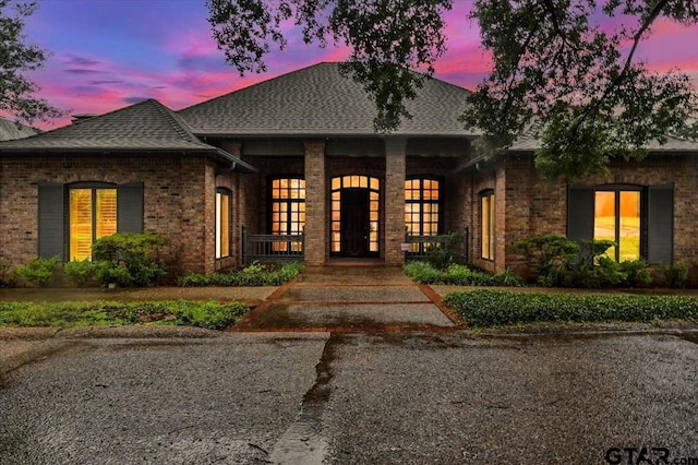 612 Rosemont Pl, Ii Place, Tyler, TX 75701 - view of front of home with roof with shingles, a porch, and brick siding