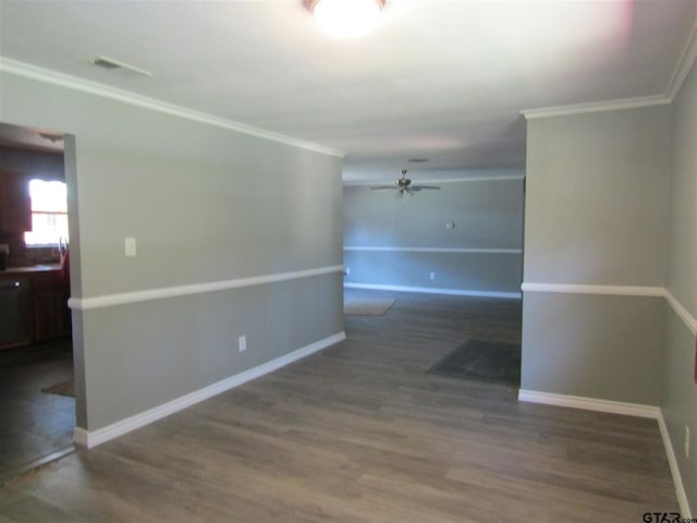 spare room featuring ceiling fan, dark hardwood / wood-style flooring, and ornamental molding