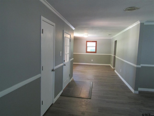 hall with dark hardwood / wood-style flooring and crown molding