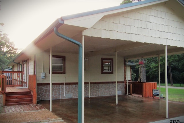 view of side of home with a carport