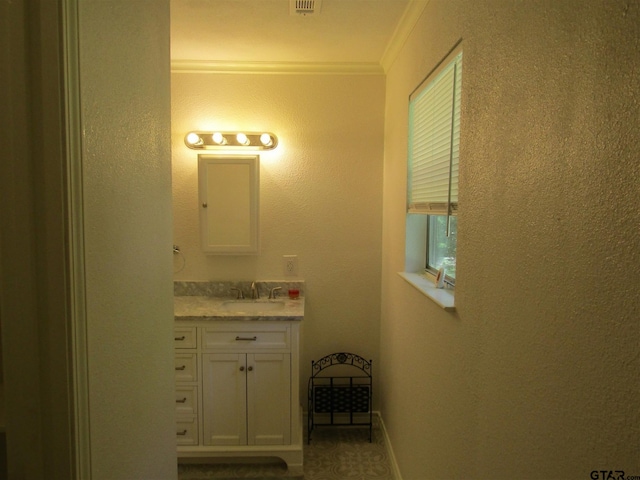 bathroom featuring vanity and crown molding