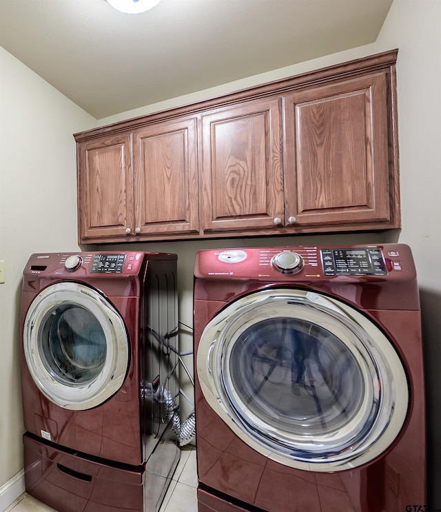 21327 Altuda Ln, Flint, TX 75762 - washroom featuring cabinet space, washer and dryer, and light tile patterned floors