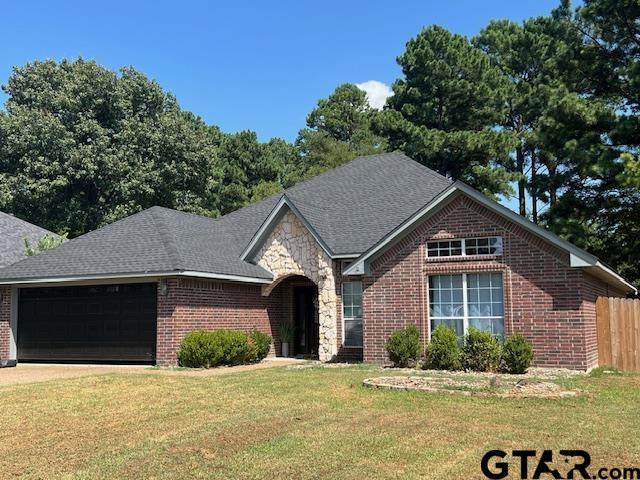 21327 Altuda Ln, Flint, TX 75762 - view of front of home with a garage, brick siding, and roof with shingles
