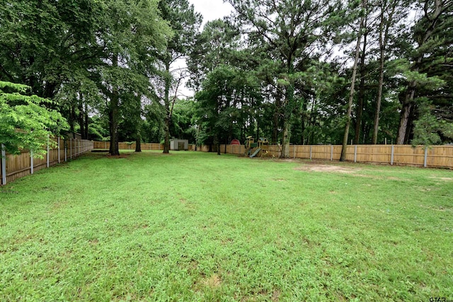 21327 Altuda Ln, Flint, TX 75762 - fenced backyard featuring a playground and a shed