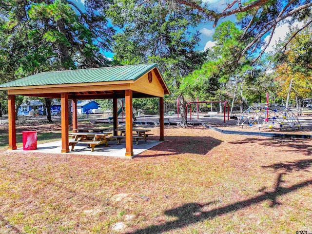 view of property's community featuring a playground and a gazebo