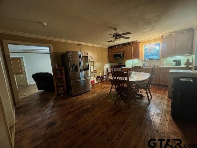 dining room with dark hardwood / wood-style floors, ceiling fan, and crown molding