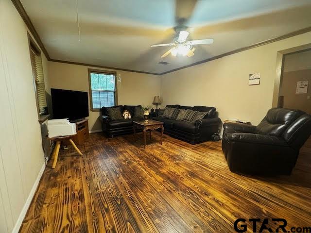 living room with ceiling fan, hardwood / wood-style floors, and crown molding