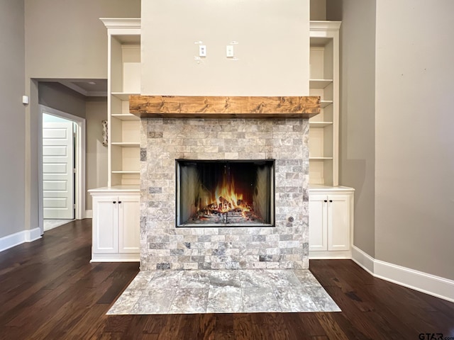 room details with hardwood / wood-style floors and built in shelves