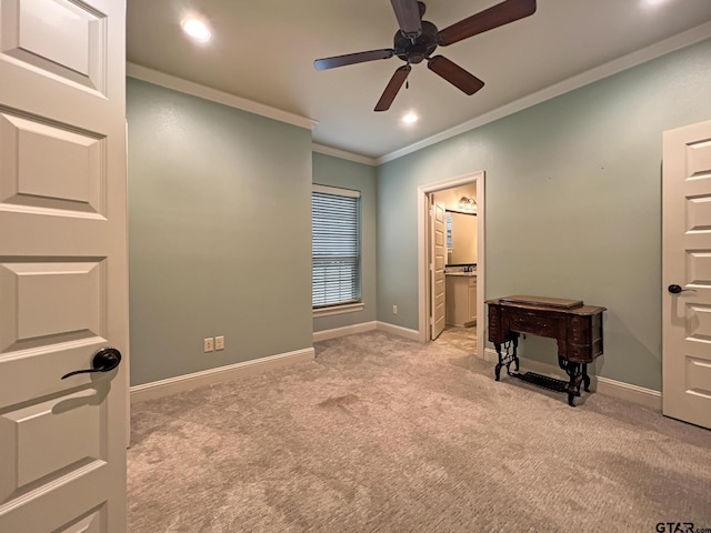 carpeted bedroom featuring crown molding, connected bathroom, and ceiling fan