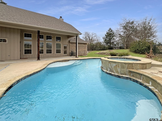 view of pool featuring a patio area and an in ground hot tub