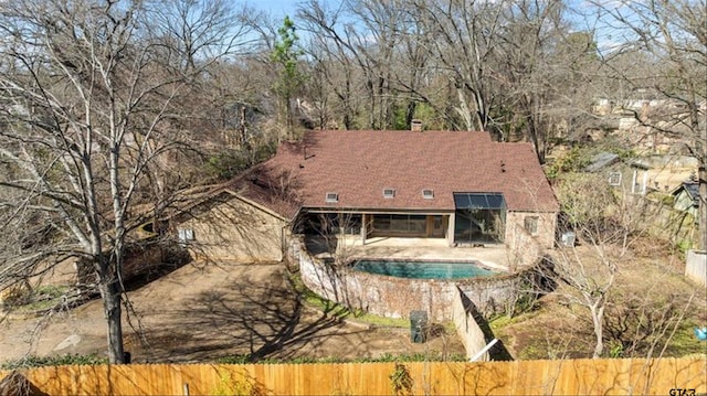 exterior space featuring a fenced backyard, a fenced in pool, and a patio