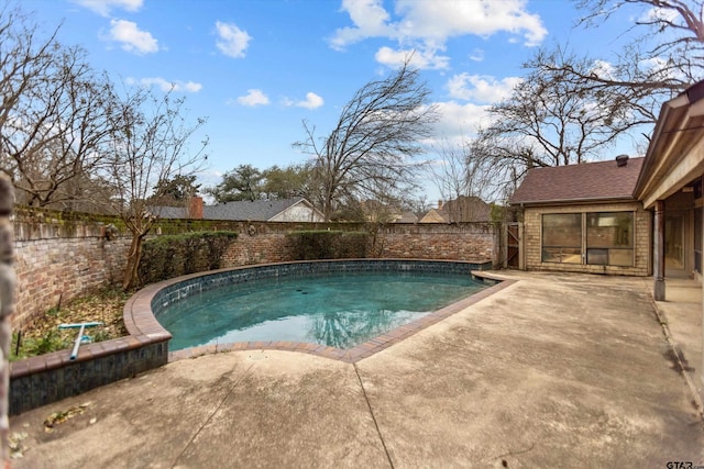 view of swimming pool featuring a fenced in pool, a patio area, and a fenced backyard