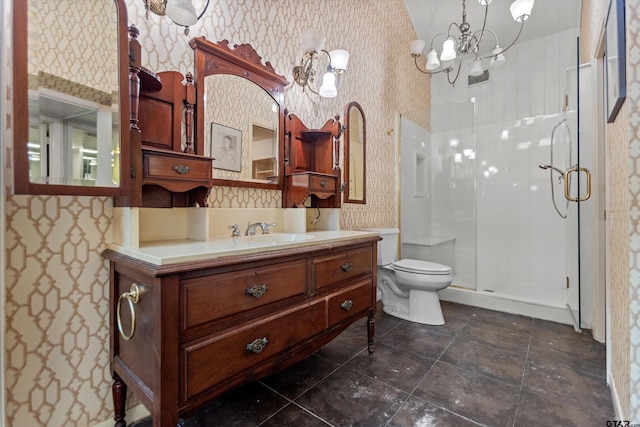 full bathroom featuring vanity, a shower stall, toilet, and wallpapered walls