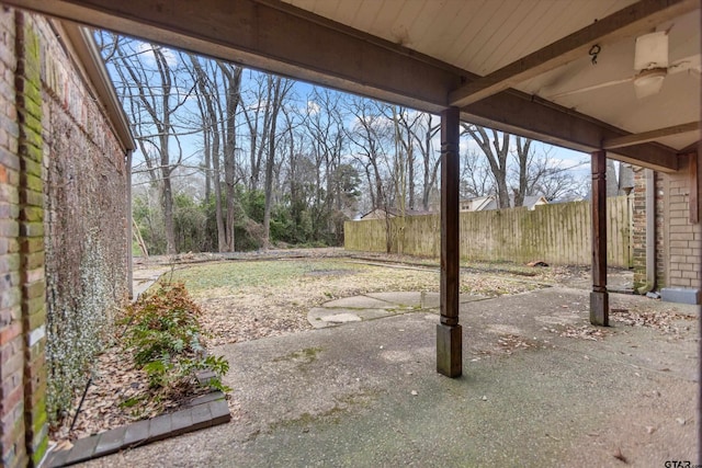 view of yard with fence and a patio