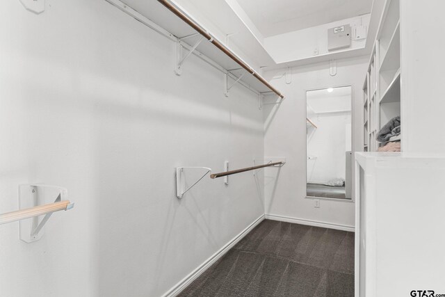 7031 Ridge Place Cir, Tyler, TX 75703 - walk in closet featuring dark colored carpet
