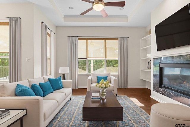7031 Ridge Place Cir, Tyler, TX 75703 - living room featuring healthy amount of natural light, a high end fireplace, ceiling fan, and wood finished floors