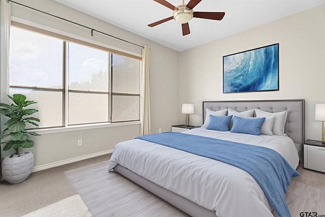 7031 Ridge Place Cir, Tyler, TX 75703 - bedroom with baseboards and ceiling fan