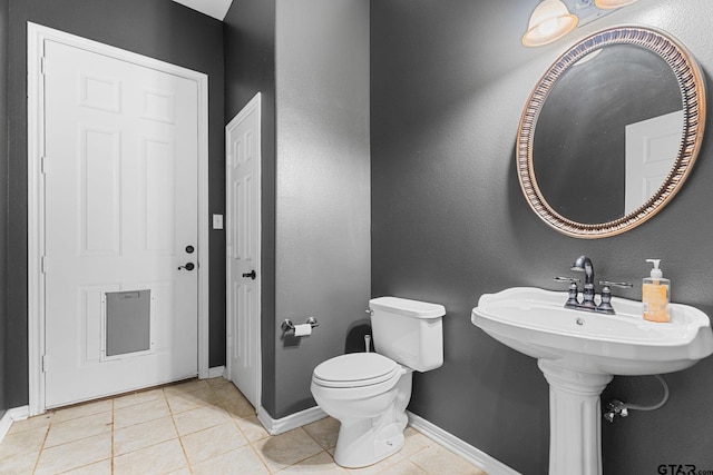 7031 Ridge Place Cir, Tyler, TX 75703 - half bathroom featuring baseboards and tile patterned floors