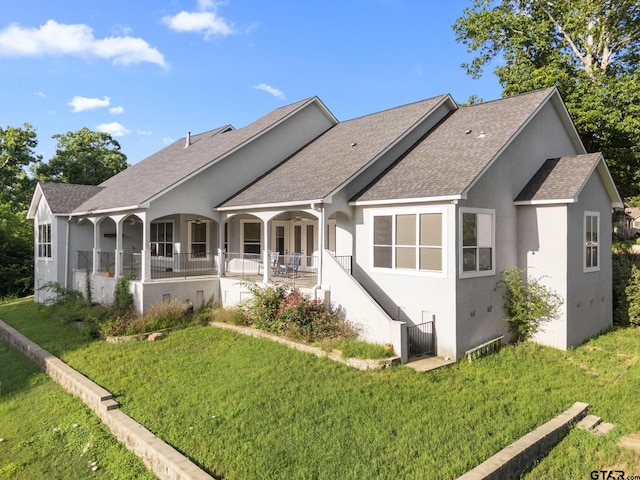 7031 Ridge Place Cir, Tyler, TX 75703 - back of property featuring a lawn, a shingled roof, and stucco siding