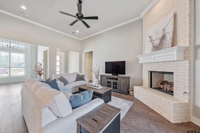 living room with dark hardwood / wood-style floors and ornamental molding