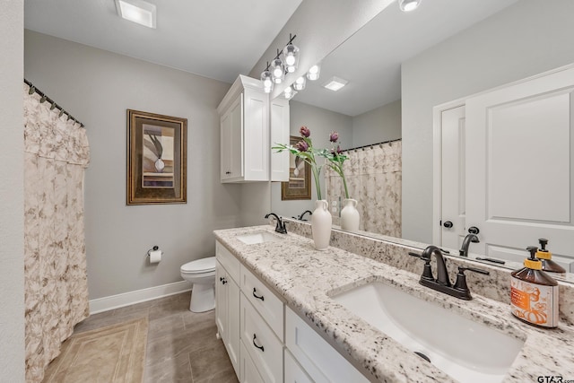 bathroom with toilet and vanity