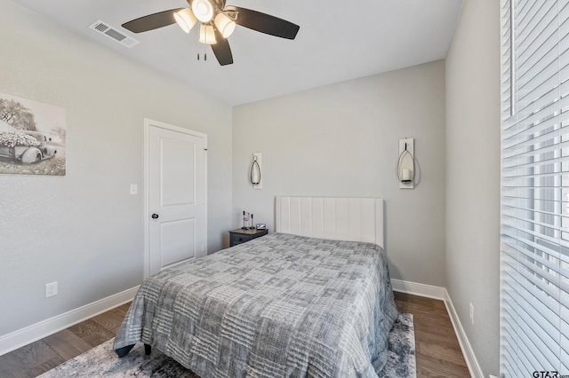 bedroom with ceiling fan and dark hardwood / wood-style flooring