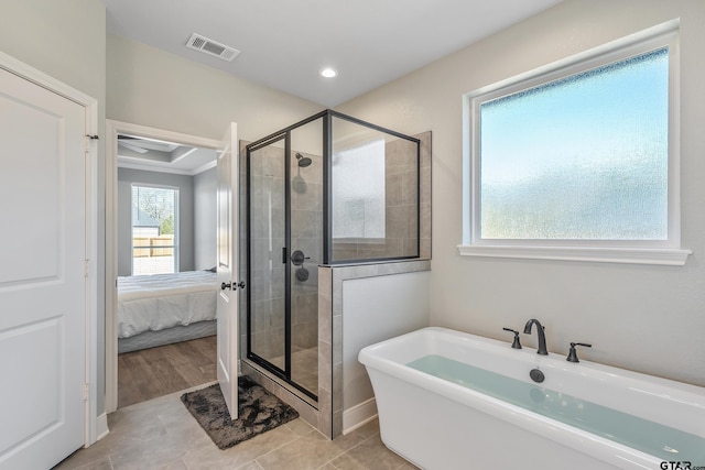 bathroom featuring independent shower and bath, tile patterned flooring, and crown molding