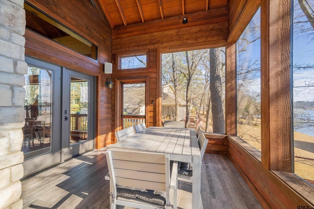 sunroom featuring wood ceiling and vaulted ceiling