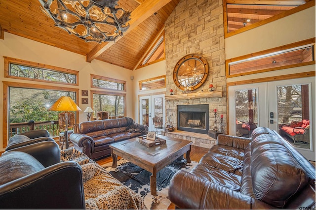 living area featuring high vaulted ceiling, french doors, wood finished floors, and wood ceiling