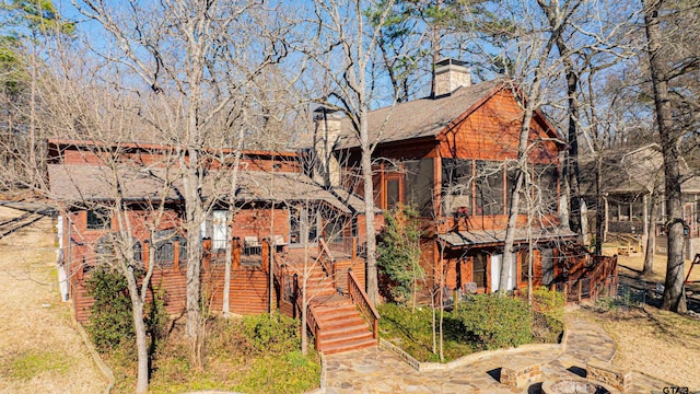 chalet / cabin featuring stairs