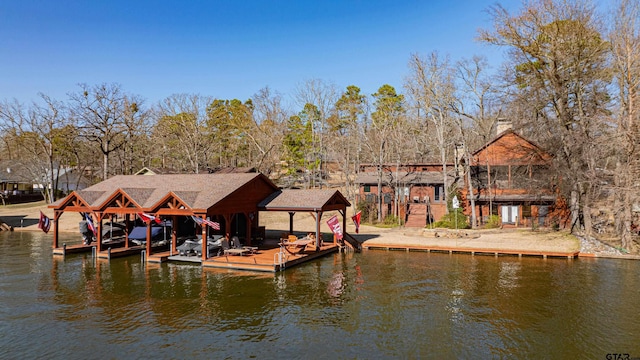 view of dock with a water view and boat lift