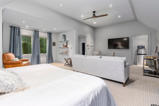 carpeted bedroom with vaulted ceiling, ceiling fan, and ornamental molding