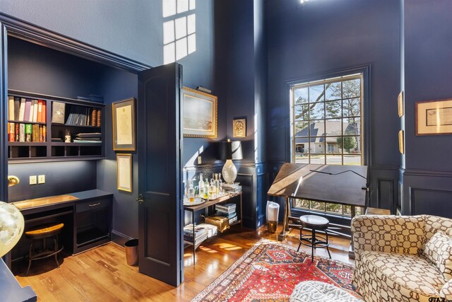 living area with light hardwood / wood-style flooring