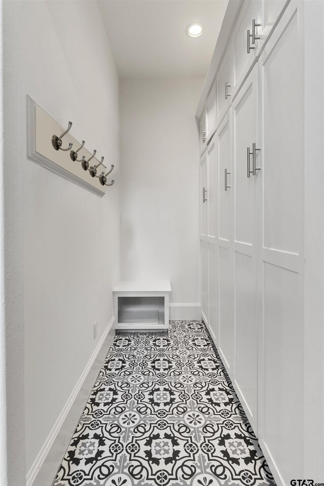 mudroom with light tile patterned floors