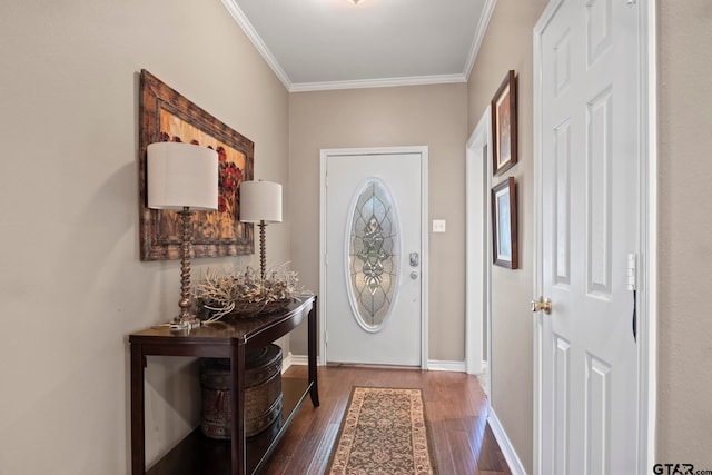 foyer entrance with dark wood-type flooring and crown molding