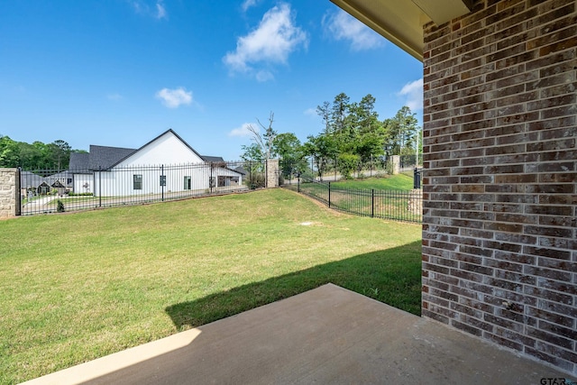 view of yard with a fenced backyard and a patio