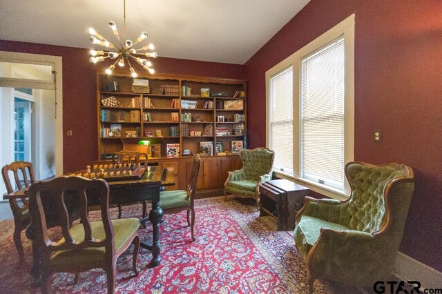 sitting room with a chandelier